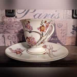Japanese Teacup and Saucer with Dogwood Design and Gold Trim.
